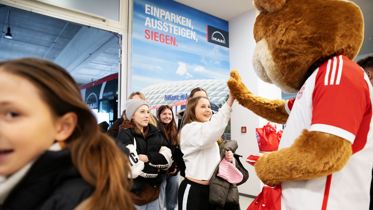 FC Bayern's mascot Bernie welcomes the children