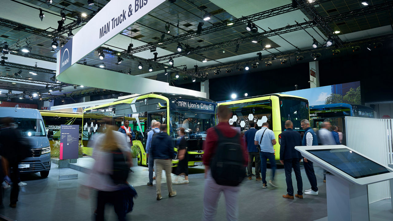 The new MAN Lion's City E electric buses in yellow-green at the trade fair