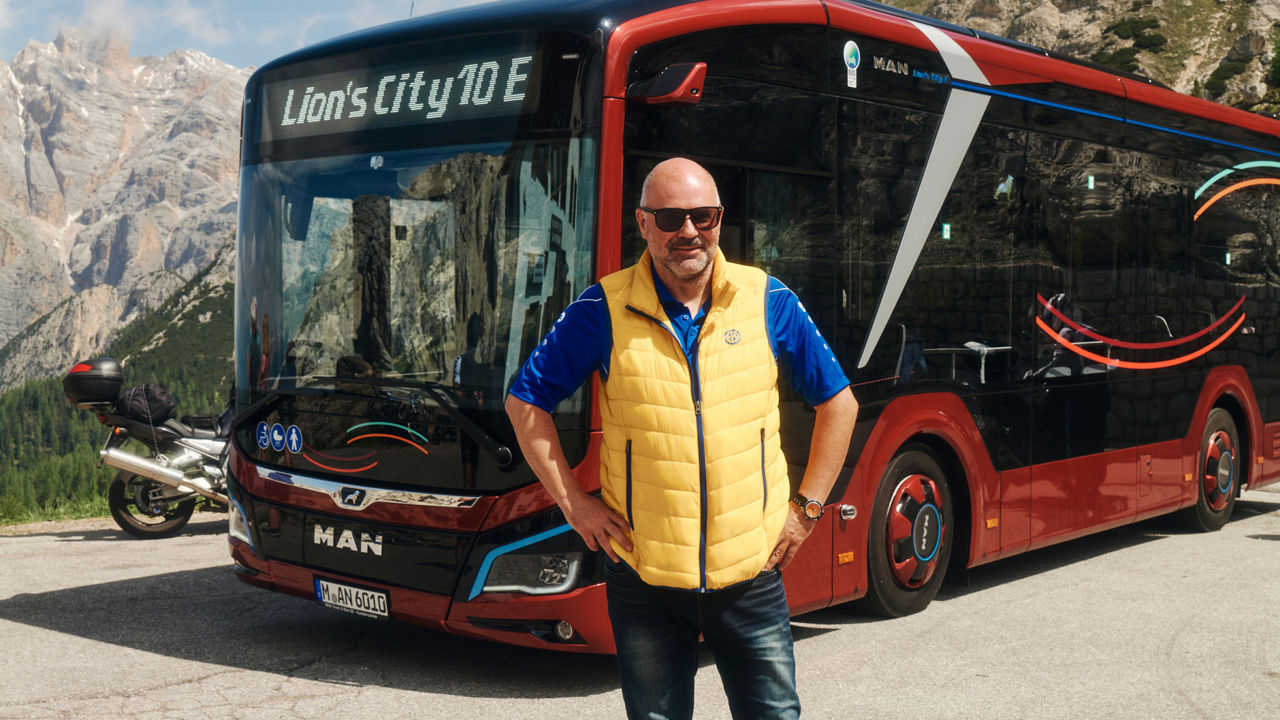 A man stands in front of the Lion's City 10 E