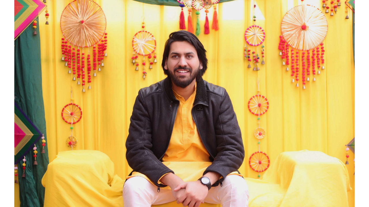 Photo by Mohit Kumar Garg against a background of Indian motifs