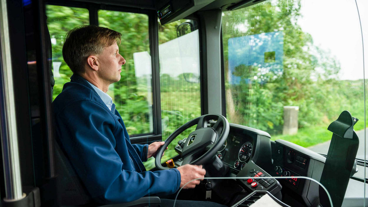 The driver is driving the bus