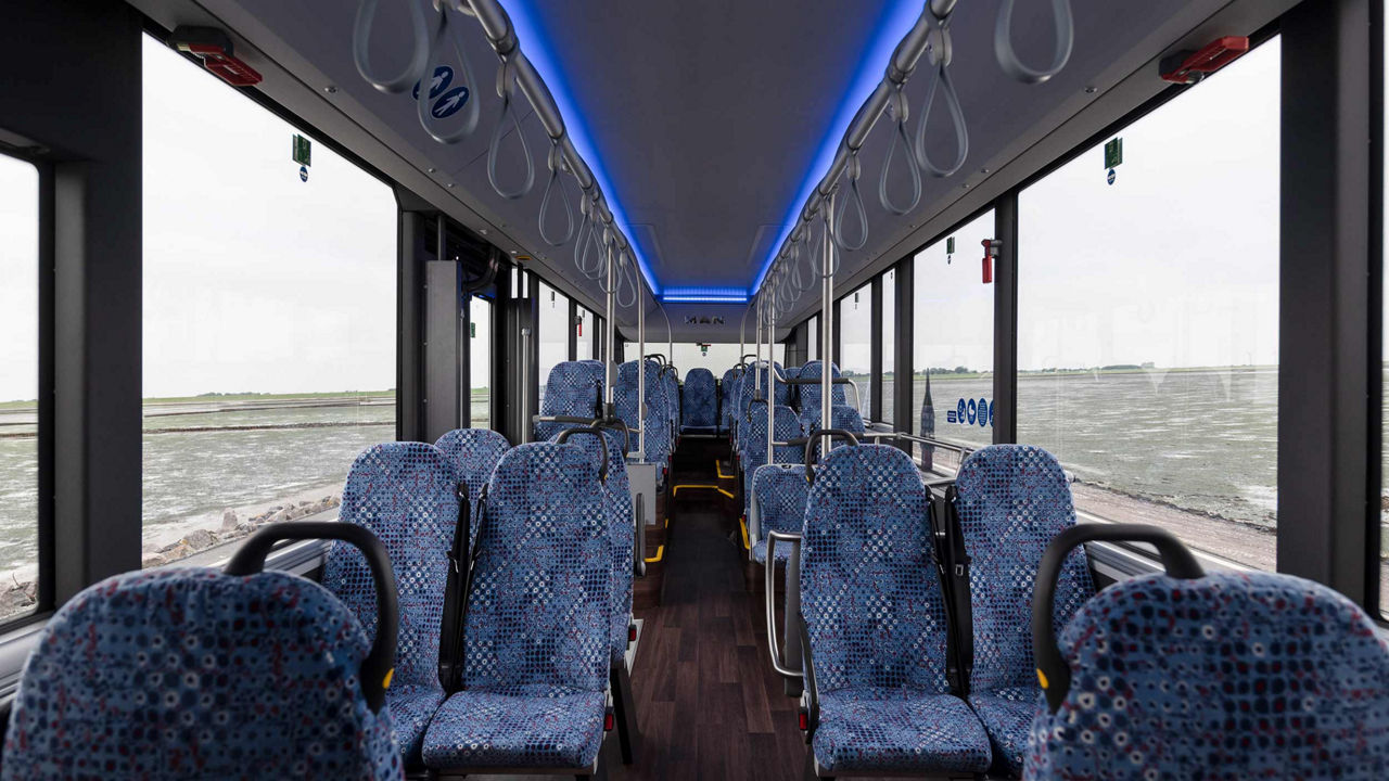 The seats on the bus are blue