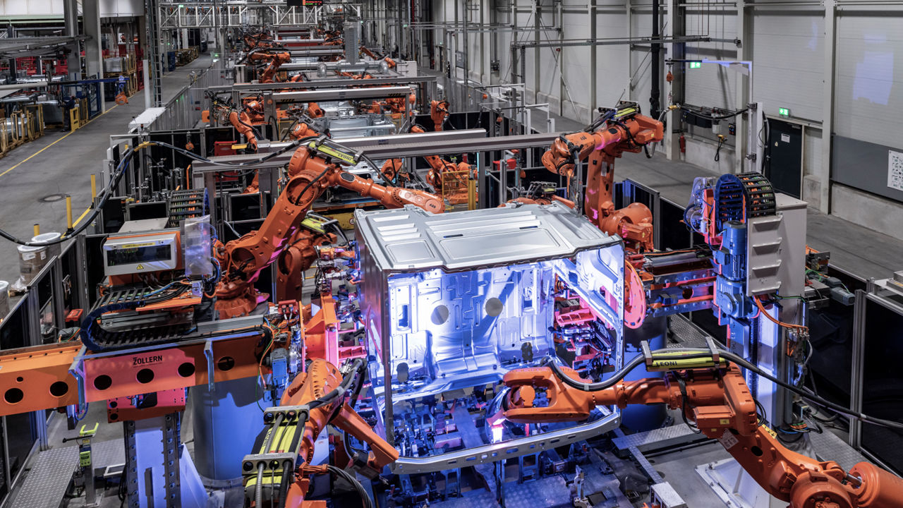 Robots work on the production of components for a new truck