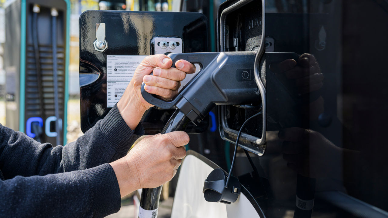 Charging an electric bus at a dedicated charging station