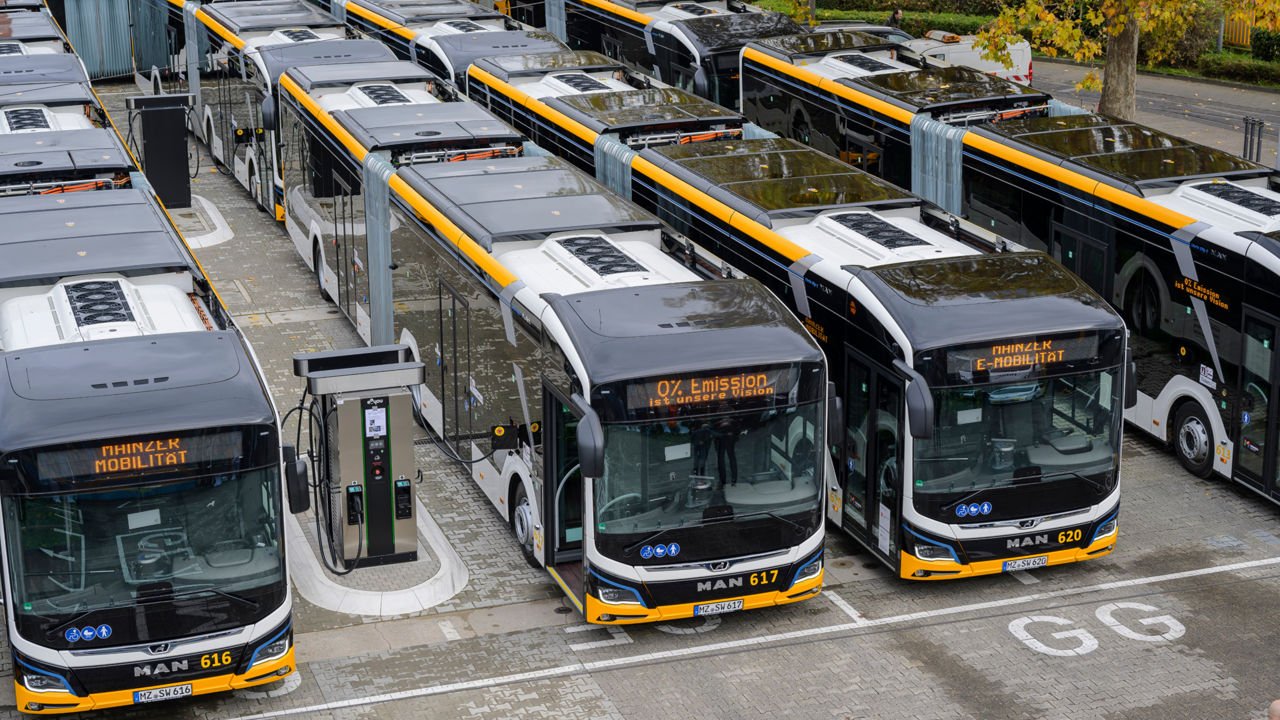 Electric buses parked at the depot are charged at the charging stations