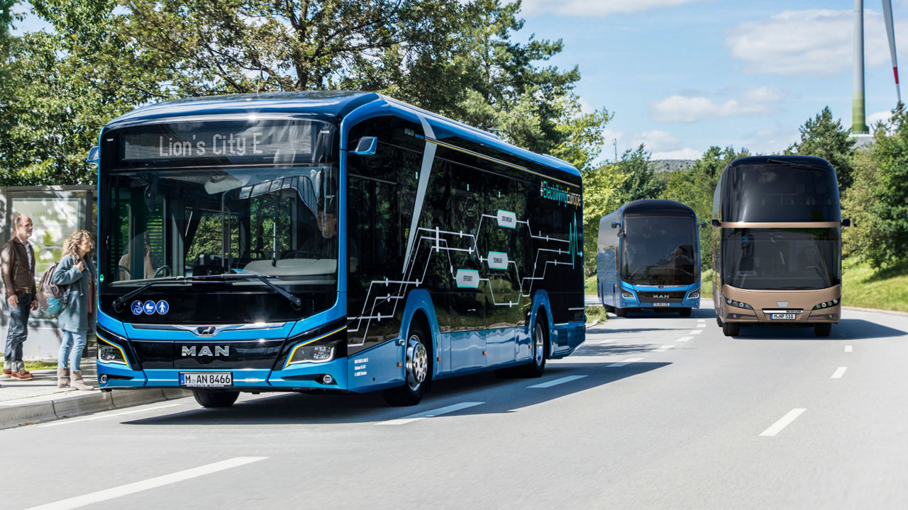 Passengers board a blue MAN bus model Lion's City E at the bus stop.