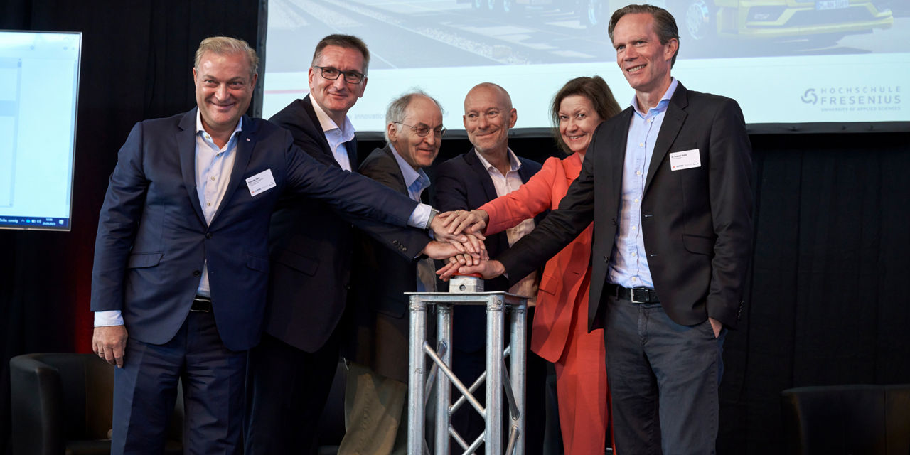 Project participants press a red button