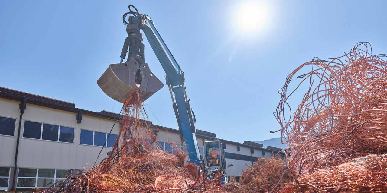 A crane at the landfill site where heaps of copper are recycled