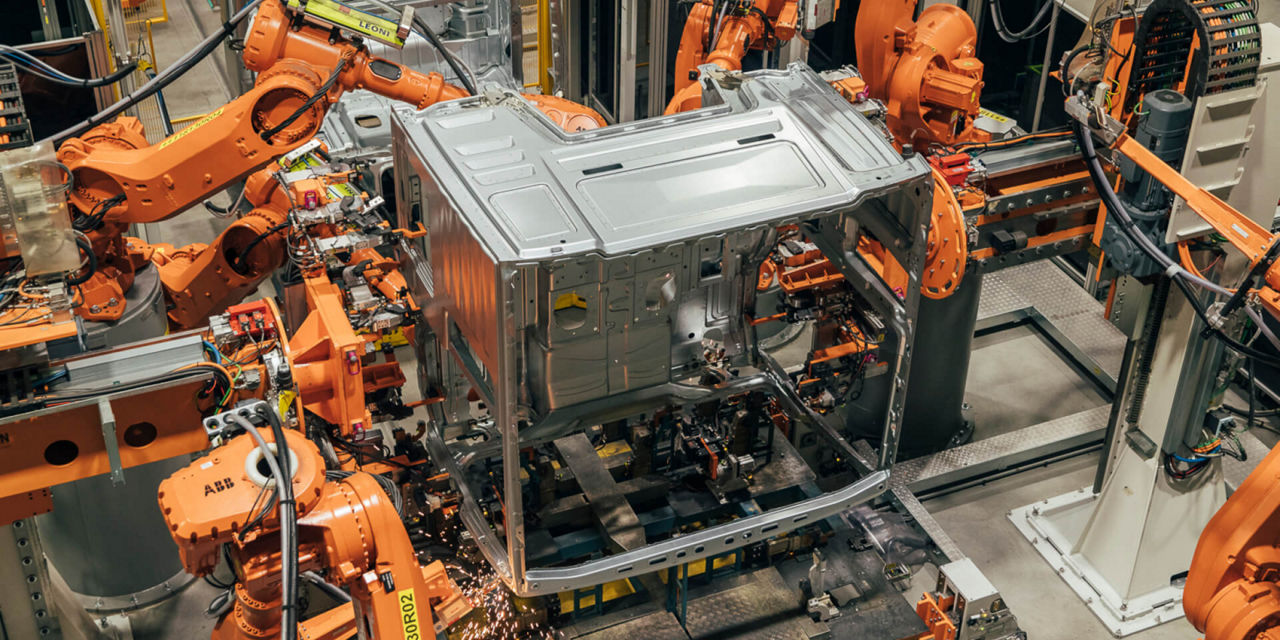 Robots build truck bodies