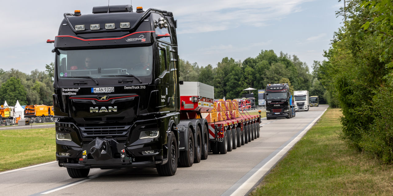 A truck is driving on a road