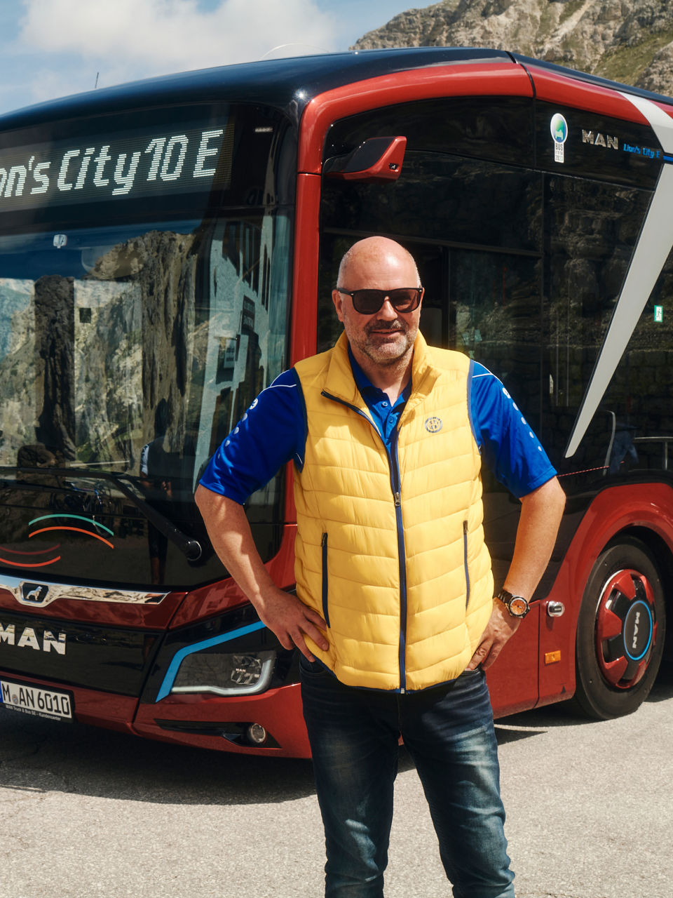 A man stands in front of the Lion's City 10 E