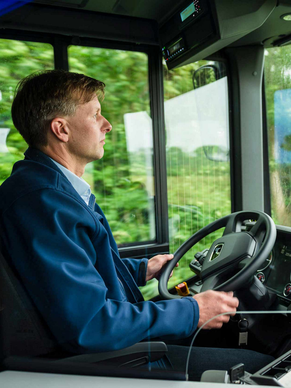 The driver is driving the bus