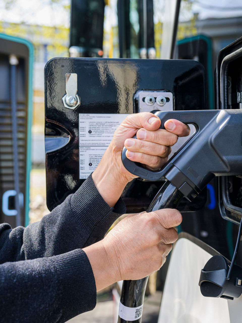 Charging an electric bus at a dedicated charging station