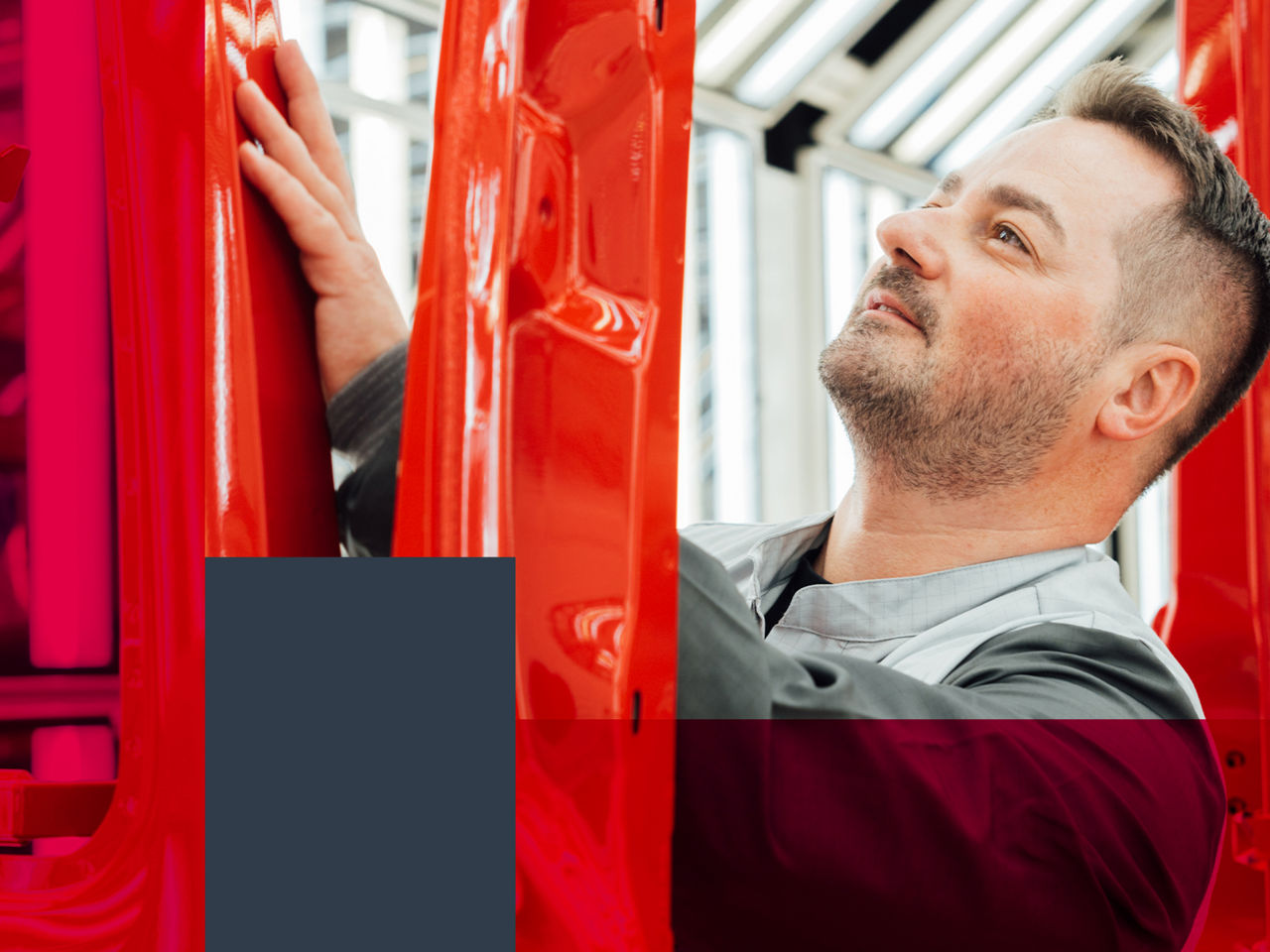 A man is working on a truck