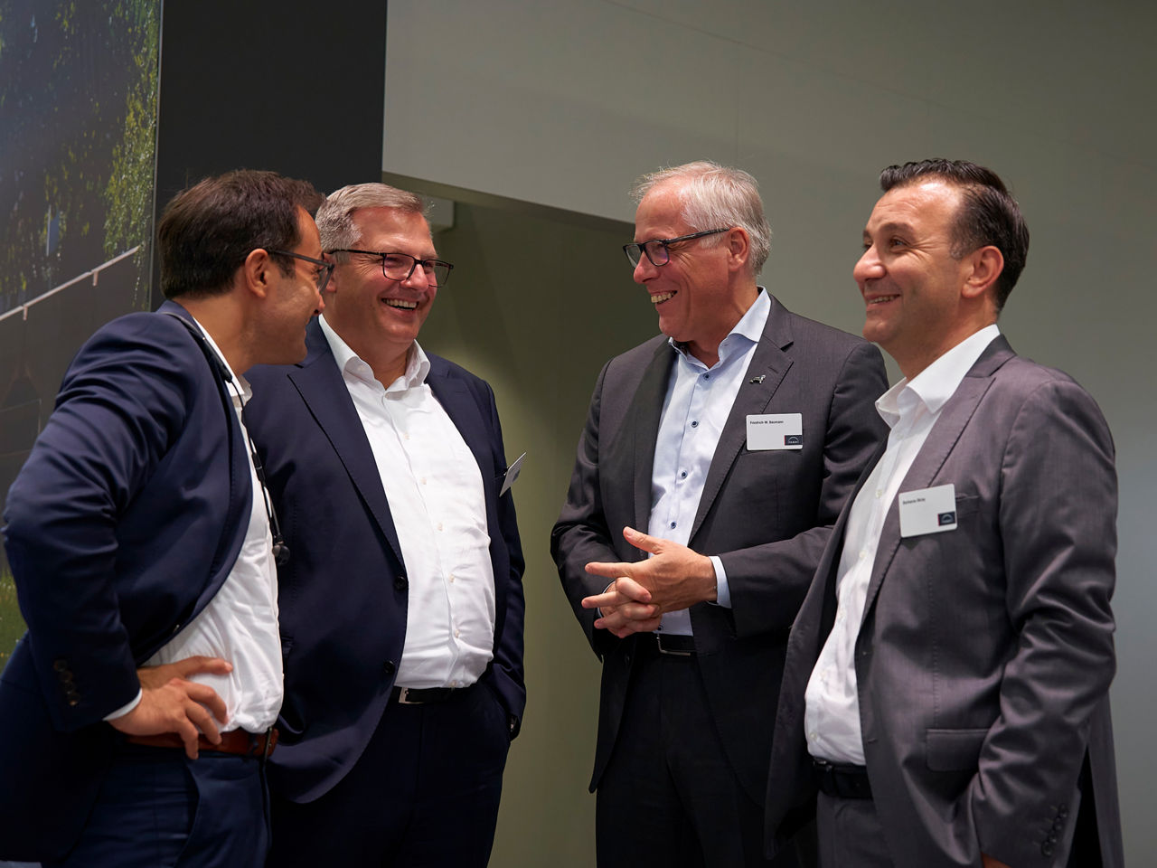 The bus managers in conversation at the trade fair