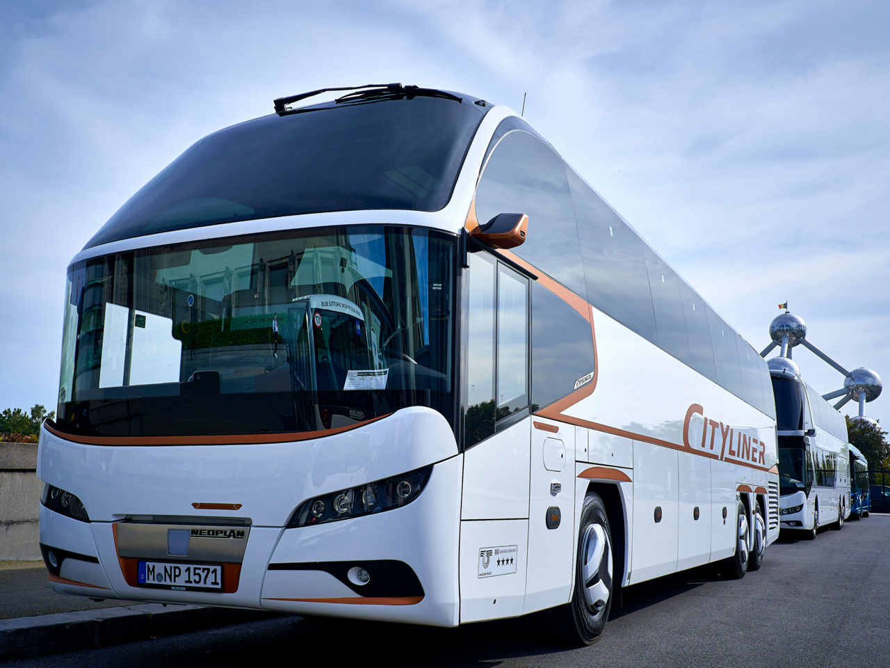White MAN bus in the outdoor area of the traid fair