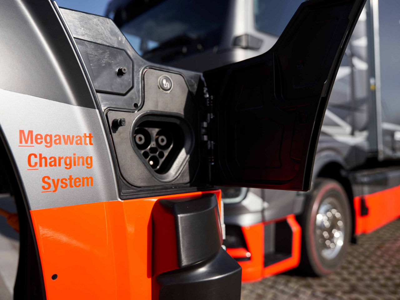 The part where the charging cable is plugged into the truck