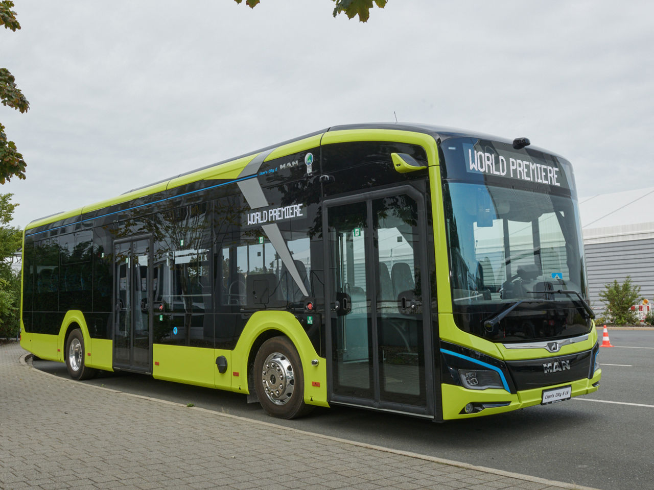 Parked bus Lion's City 12 E LE in yellow-green color