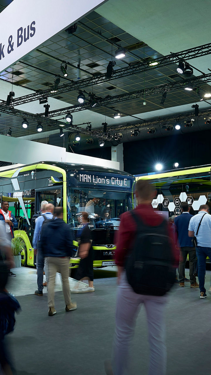 The new MAN Lion's City E electric buses in yellow-green at the trade fair