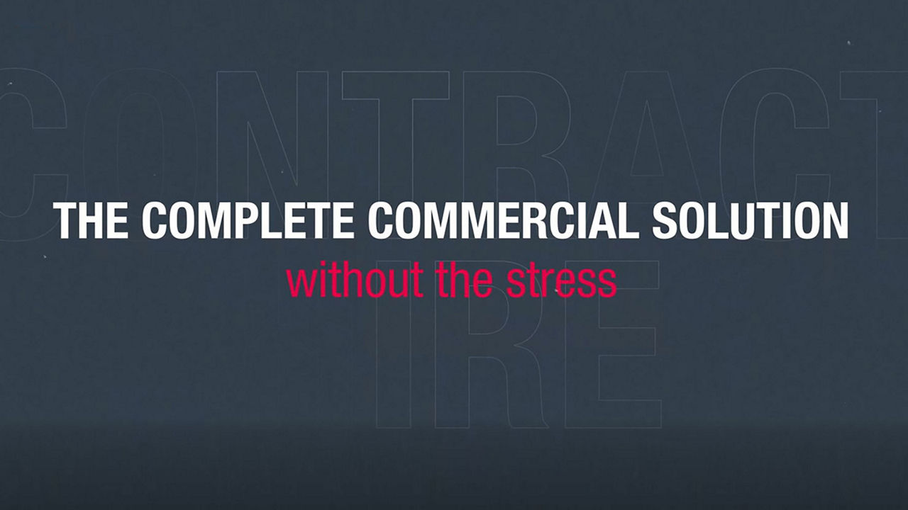 Video still with dark background and whit text "The complete commercial solution"
