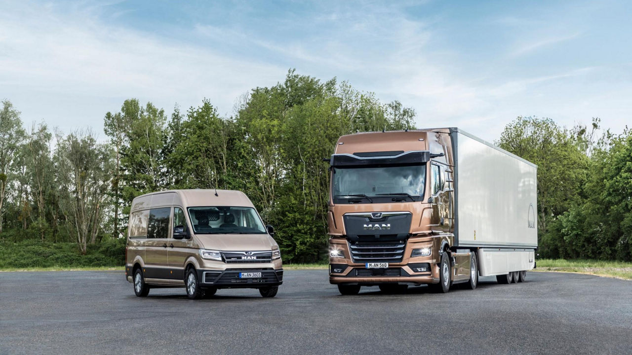  MAN TGE and MAN TGX side by side in parking lot