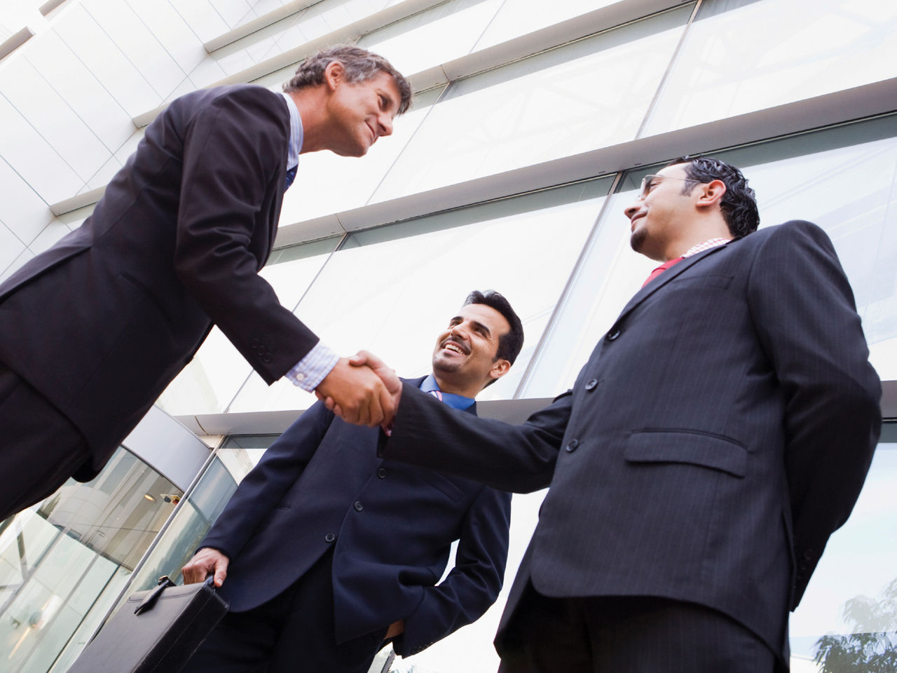 Three men in negotiation meeting