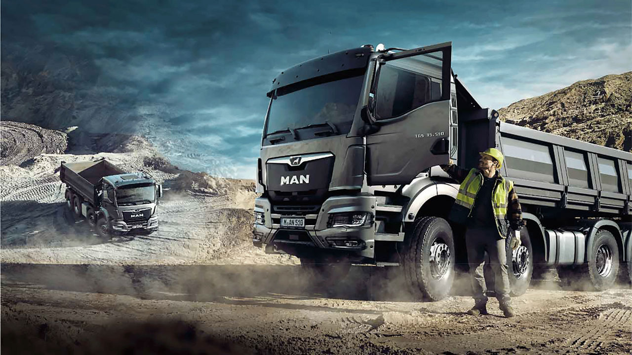 MAN truck in sandy work environment