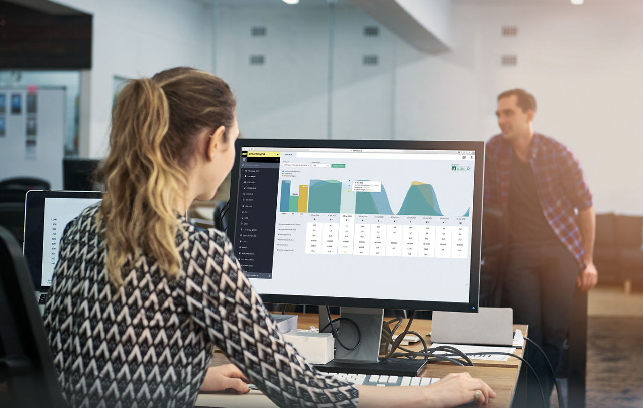 Shot of a young woman using a computer at her desk in a modern office
