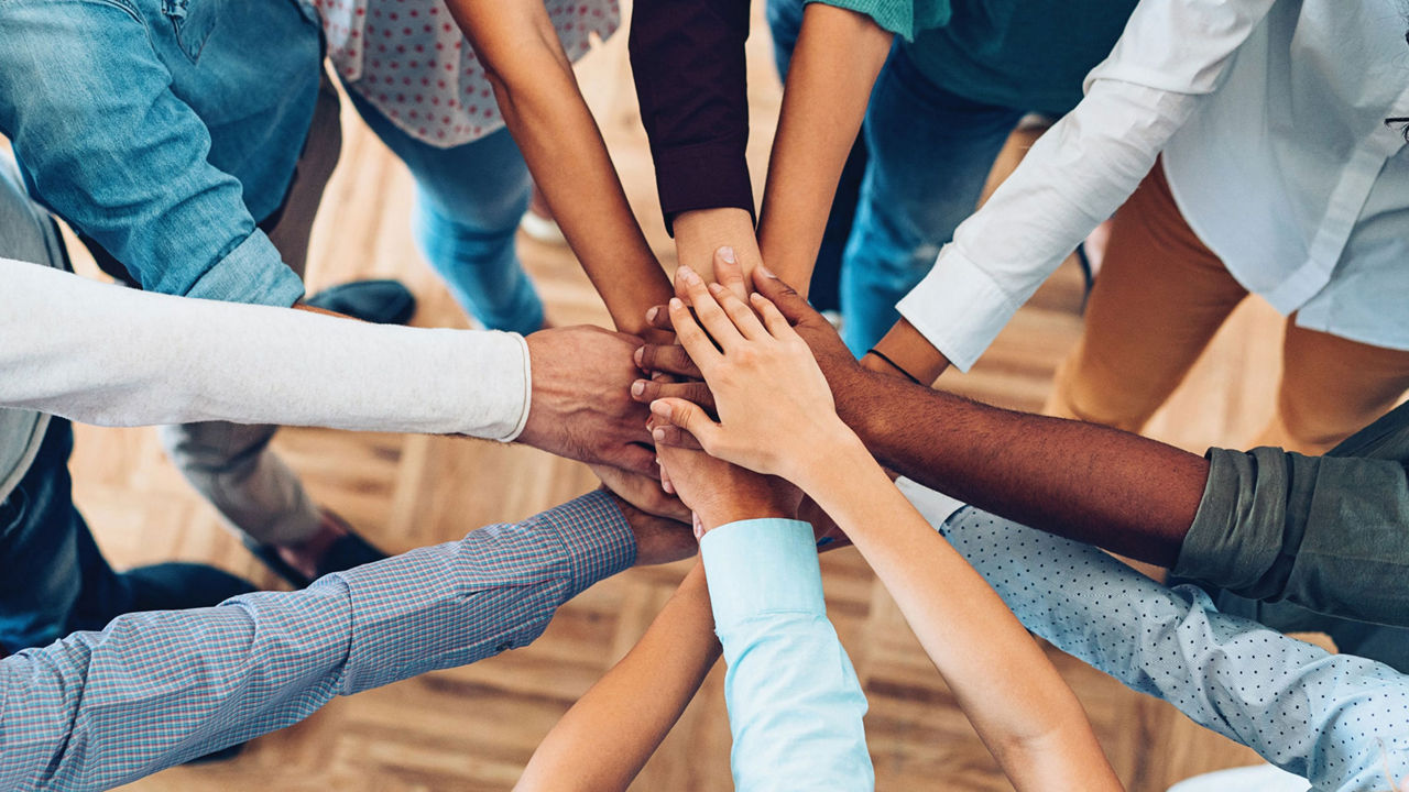 Hands lying on top of each other