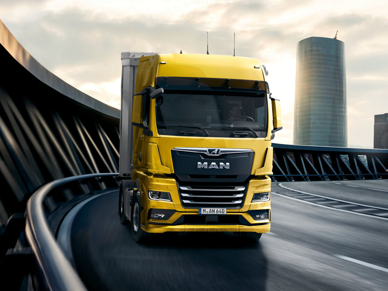 A new MAN TGX drives on a road 