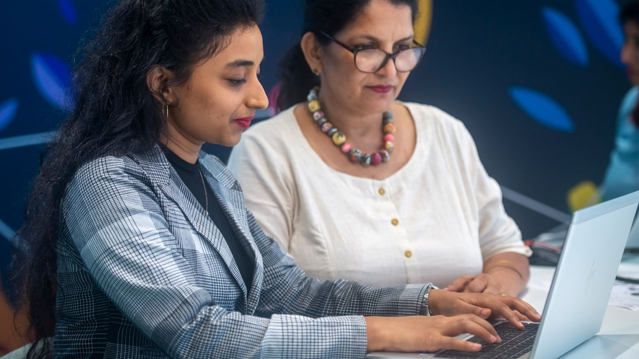 A woman works on a laptop 