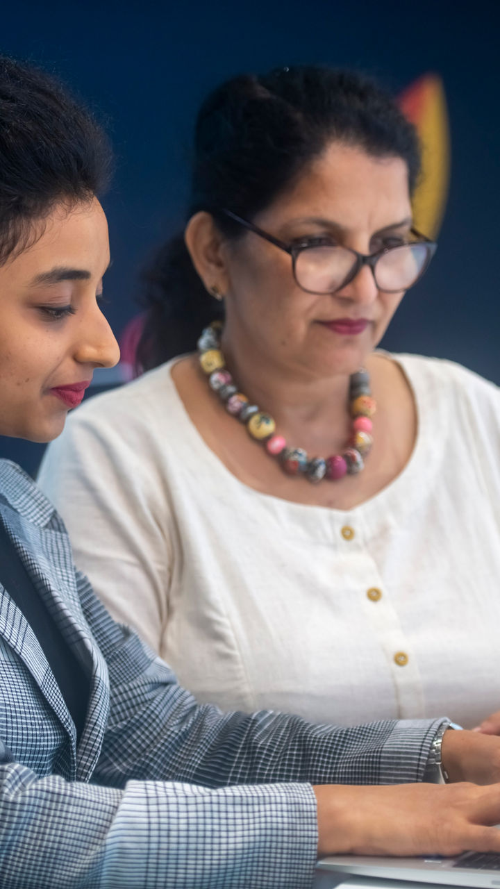 A woman works on a laptop 