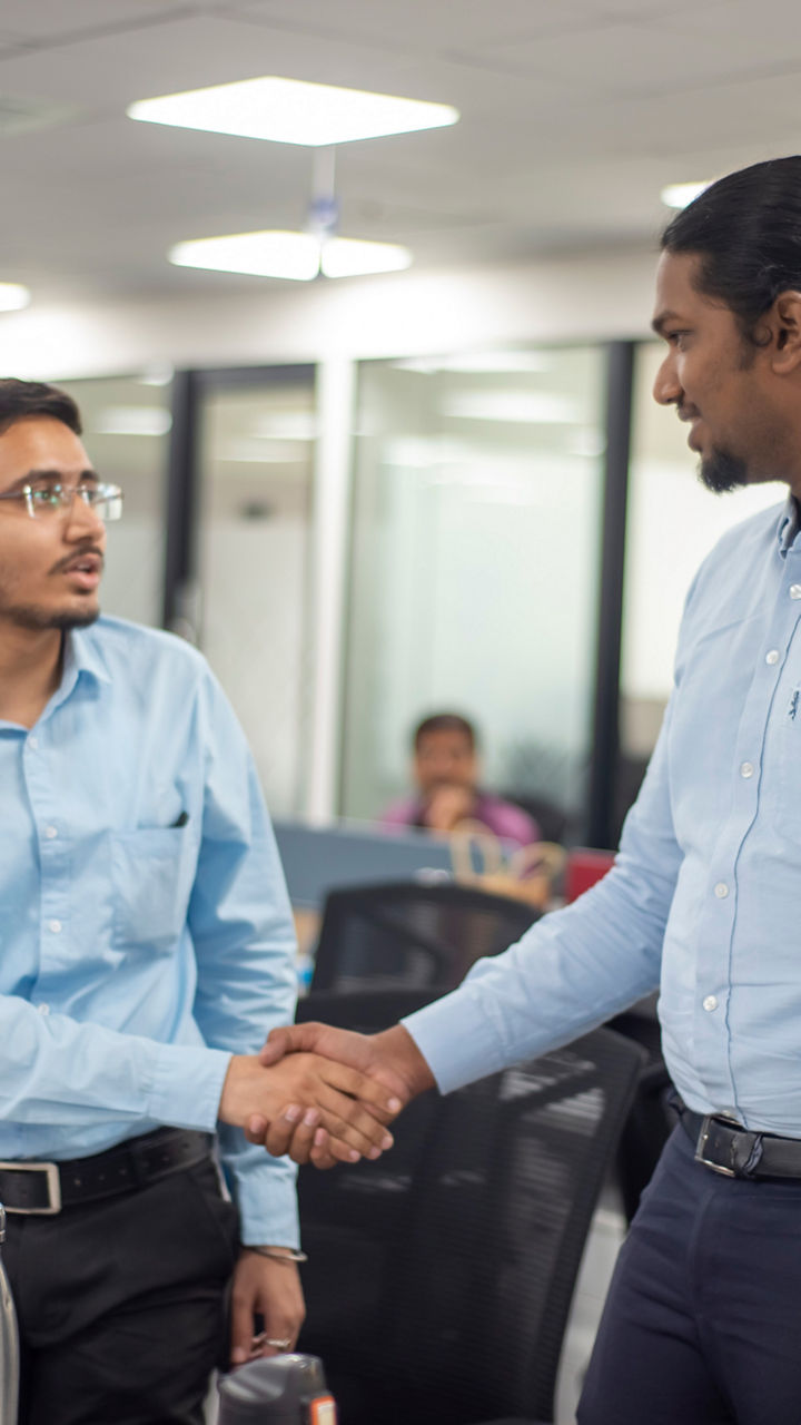 Two engineers shake hands 