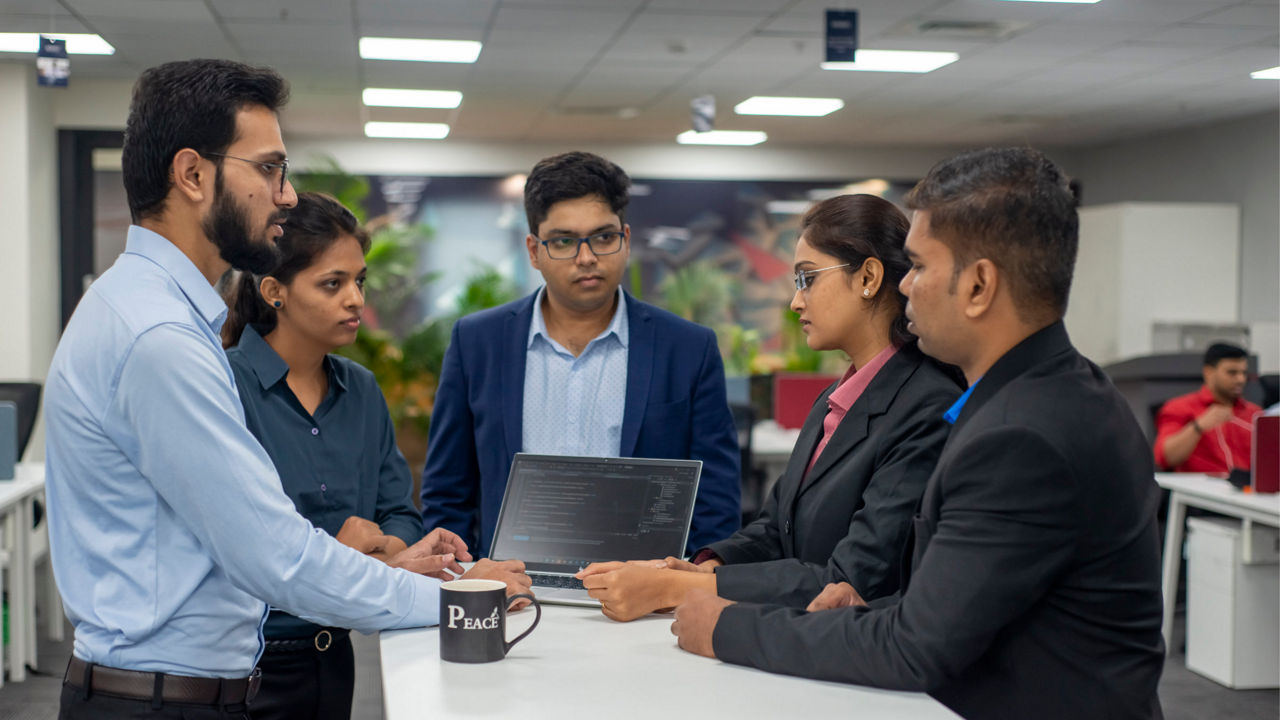 A group of engineers in conversation 