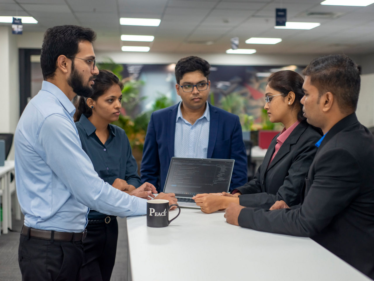 A group of engineers in conversation 