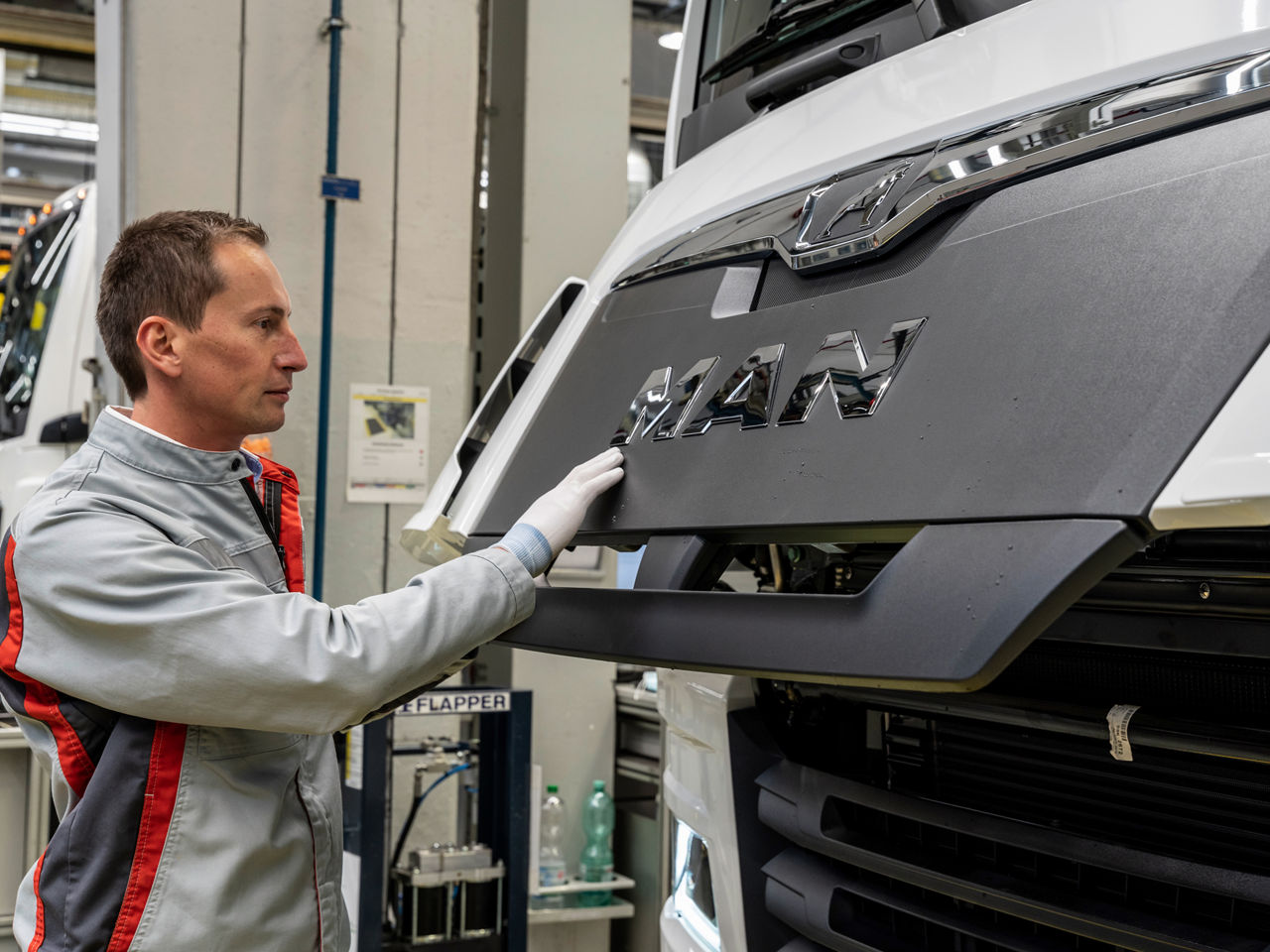 MAN employees in a production hall