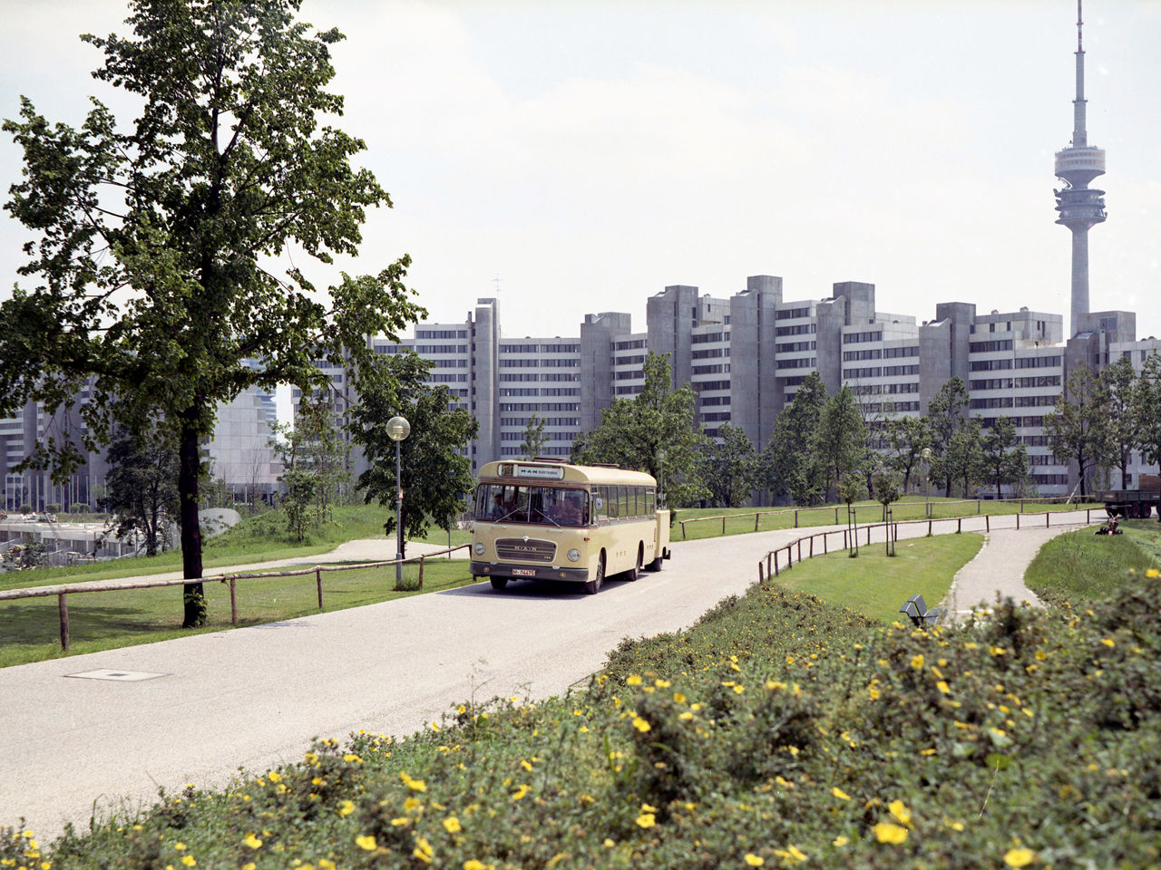 An old MAN bus. In the background the Olympic Village and the television tower. 