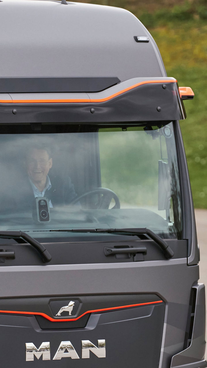 Dr Markus Söder and Alexander Vlaskamp in the cockpit of a truck. 