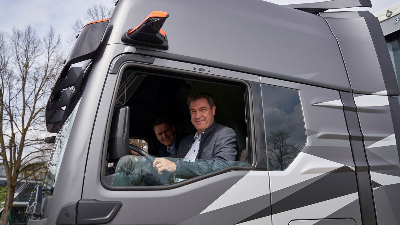 Dr Markus Söder in the cockpit of a truck. 