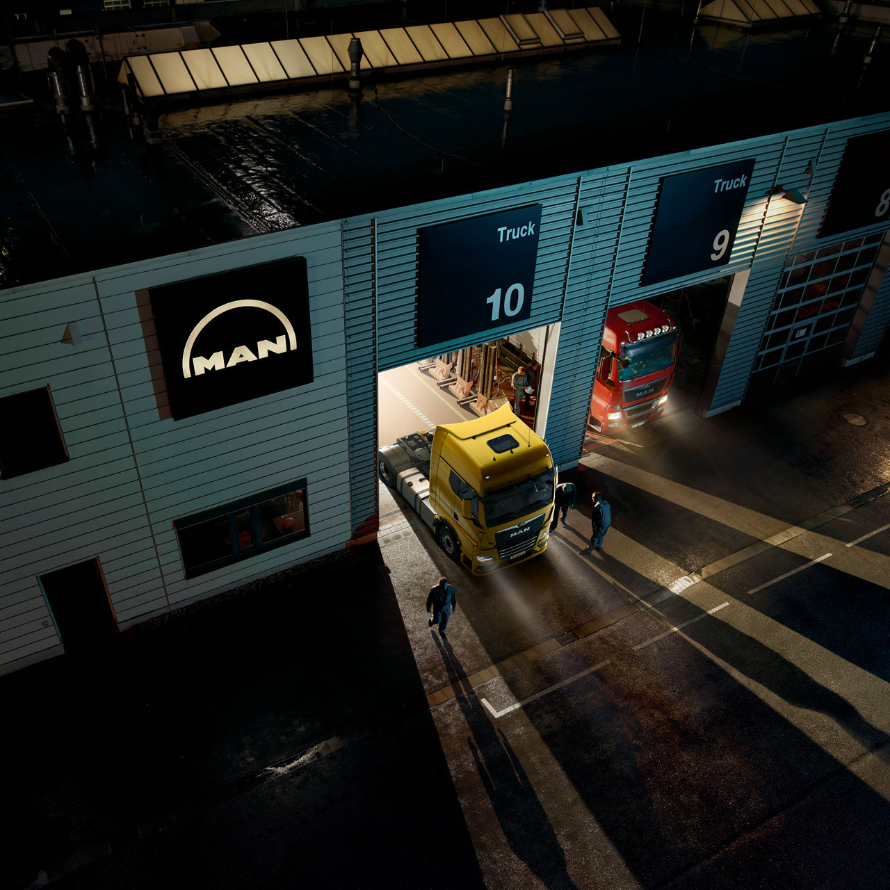 MAN trucks standing in a service garage.