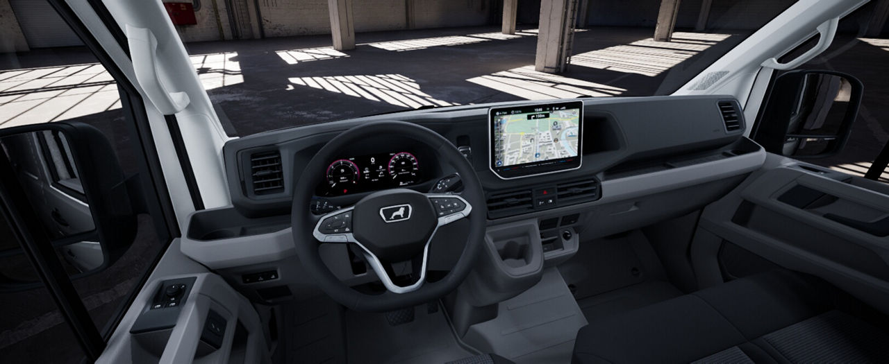 Interior cockpit of a MAN van with steering wheel, dashboard, and infotainment display.