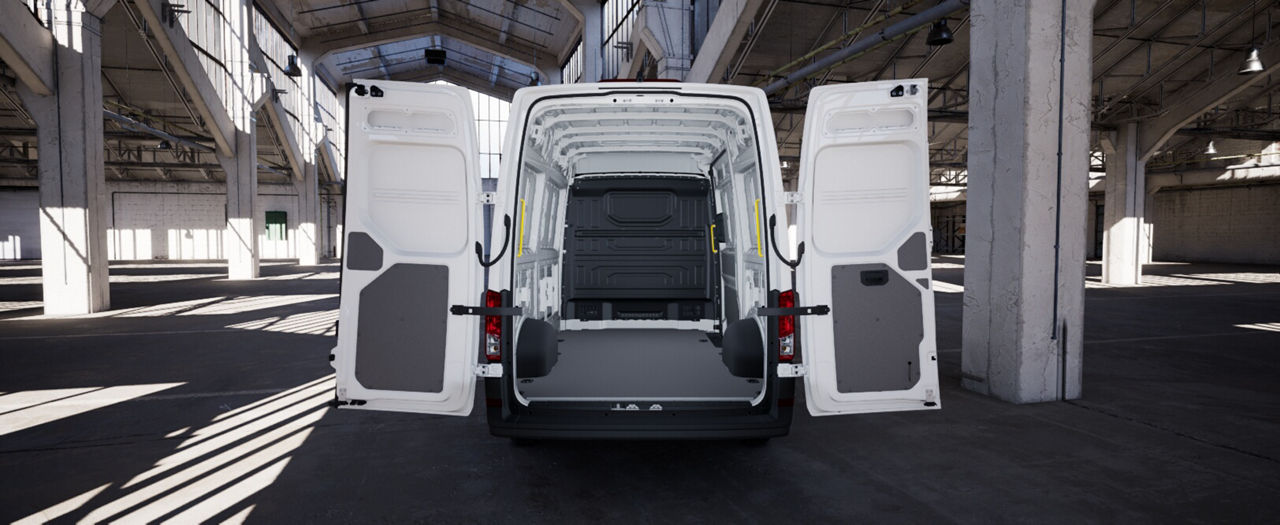 Open cargo area of a white MAN van showing the empty load compartment.