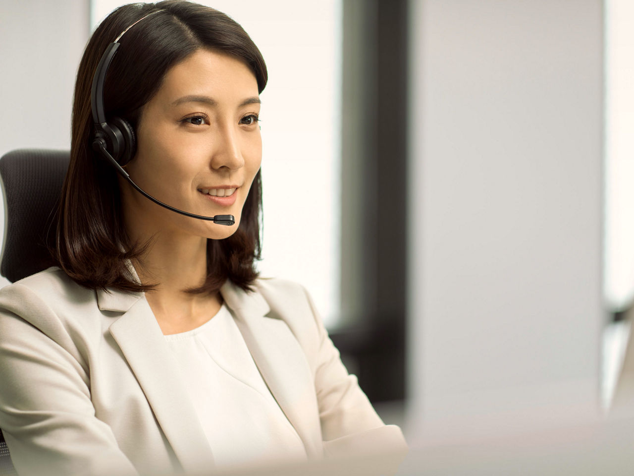 Woman making a call via the headset