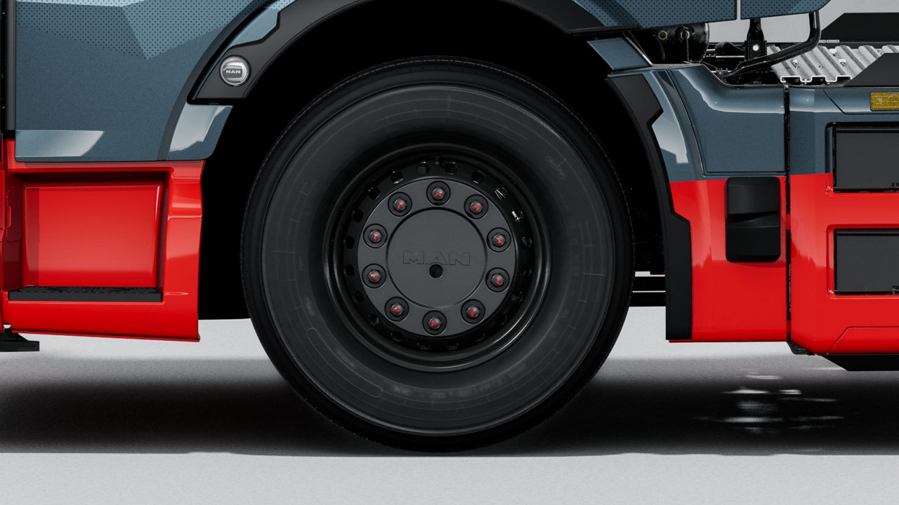 Black steel rims with wheel covers and nut caps.
