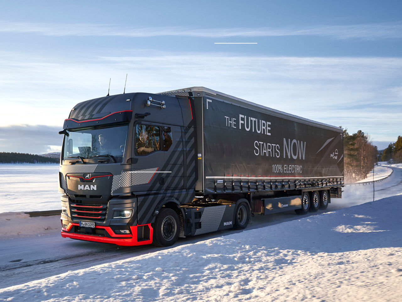 MAN eTruck with trailer on snowy road, labeled The Future Starts Now 