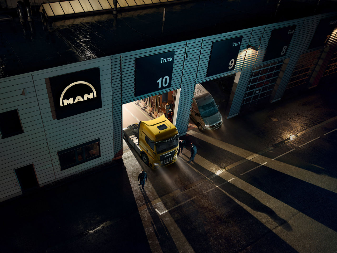 MAN trucks in a service garage.